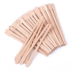 Wooden stirring sticks arranged.