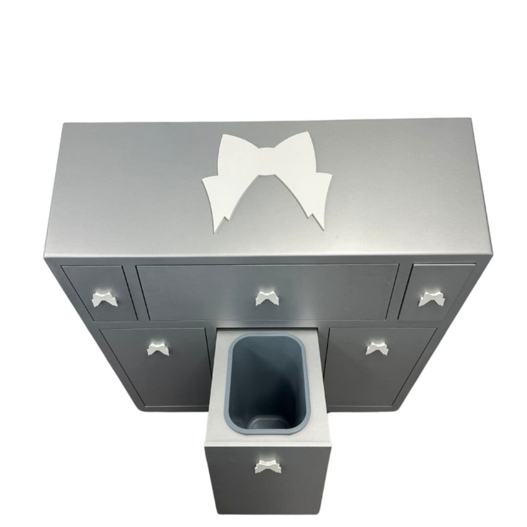 ModeloSloping Top Waxing Cabinet with built-in Wax and Roll-on Warmers - 3 Silver vanity with bow accent